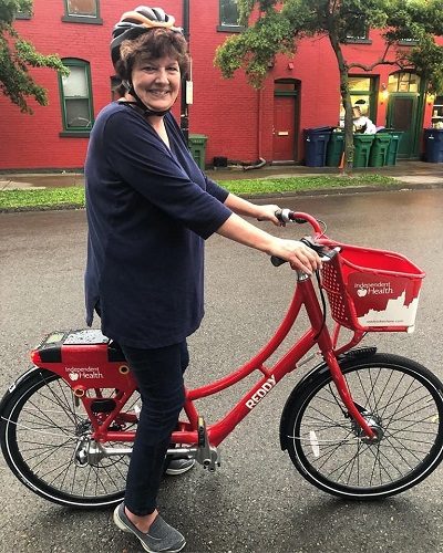 Photo of a woman using a bikeshare bicycle.