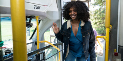 DSC02027 Woman smiles as she boards the bus