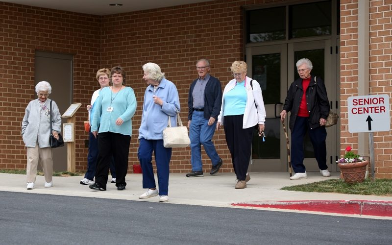 Group of older adults leaving a senior center