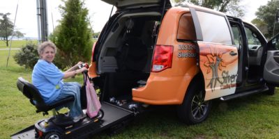 SilverSource Inc Woman on scooter going up ramp into van