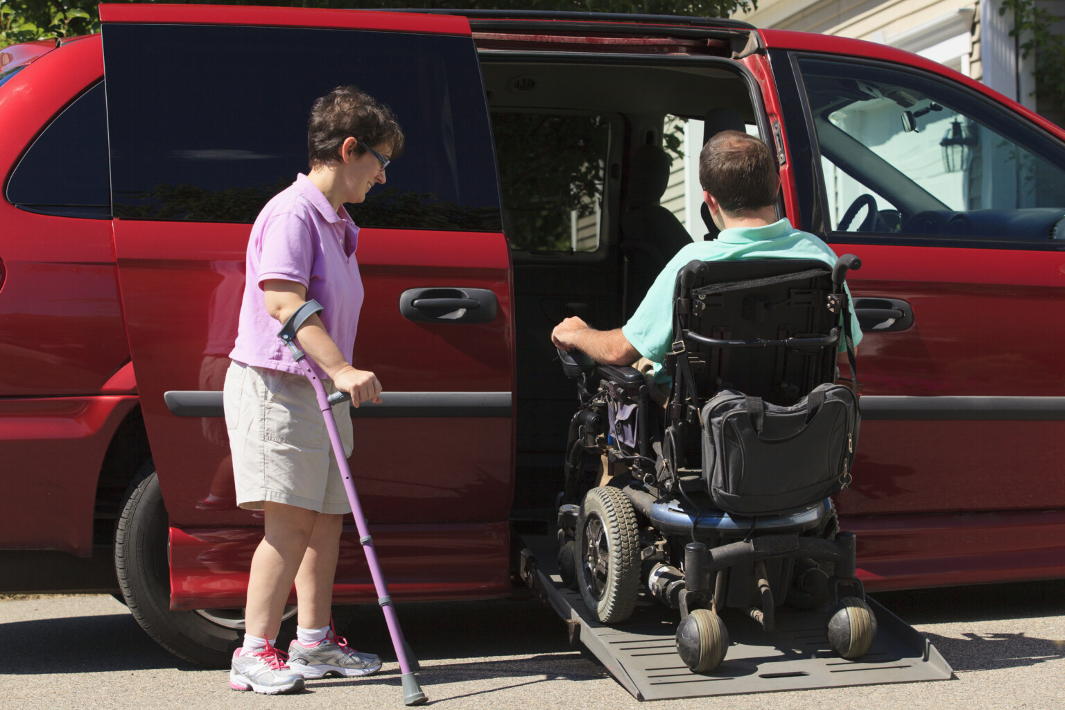 A group of older adults exits an accessible bus.