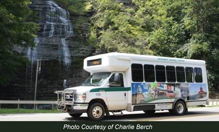 ARC transit bus in front of waterfall